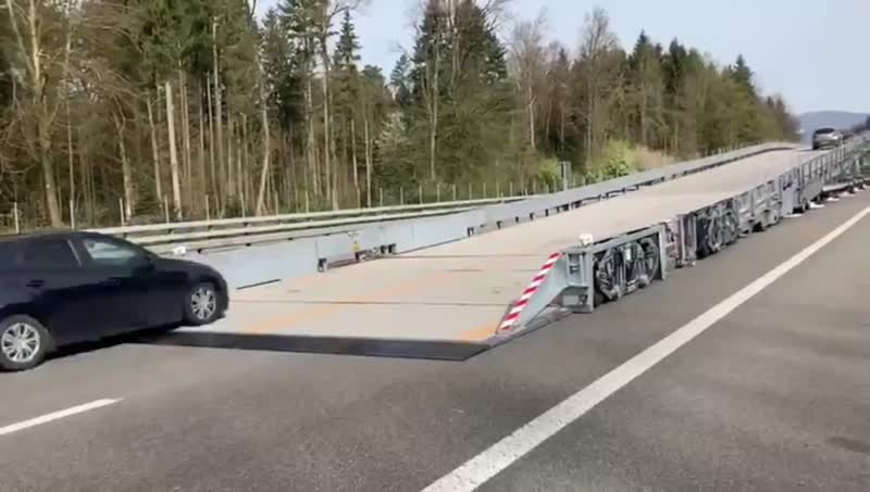 Switzerland uses a mobile overpass bridge to carry out road work without stopping traffic