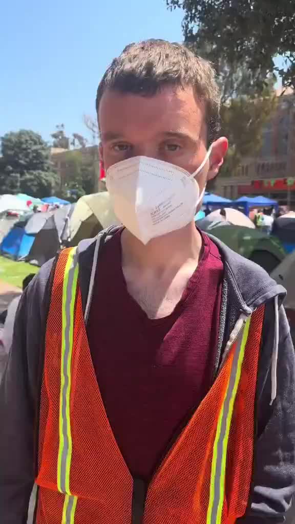 white pro-Palestine domestic terrorists harassing a black student and his daughter at UCLA encampment.