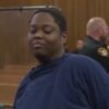 Woman who is accused of killing a 3-year-old boy in a grocery store parking lot in Cleveland smirks in court