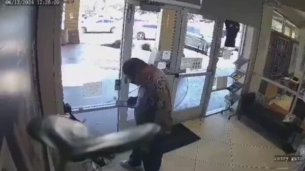 Newly released footage captures a 20-person smash-and-grab robbery breaking through the front doors of a jewelry store and smashing the display cases while two employees hide inside