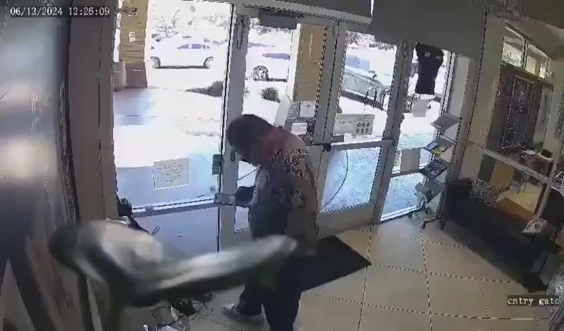 Newly released footage captures a 20-person smash-and-grab robbery breaking through the front doors of a jewelry store and smashing the display cases while two employees hide inside