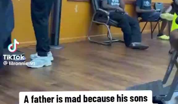 father (black shirt) was pissed because his son’s stepdad (blue shirt) took him to the barbershop to get a haircut