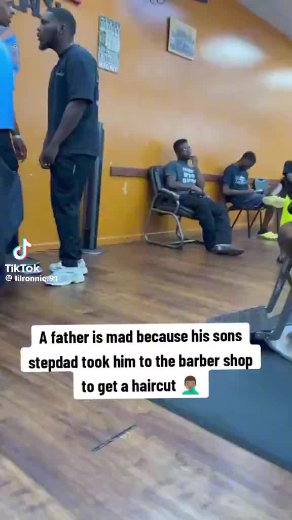 father (black shirt) was pissed because his son’s stepdad (blue shirt) took him to the barbershop to get a haircut