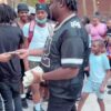 Tee Grizzley handing out bread in the trenches