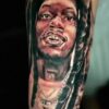 Julio Foolio's mother got his face tattooed on her arm. Rest in peace