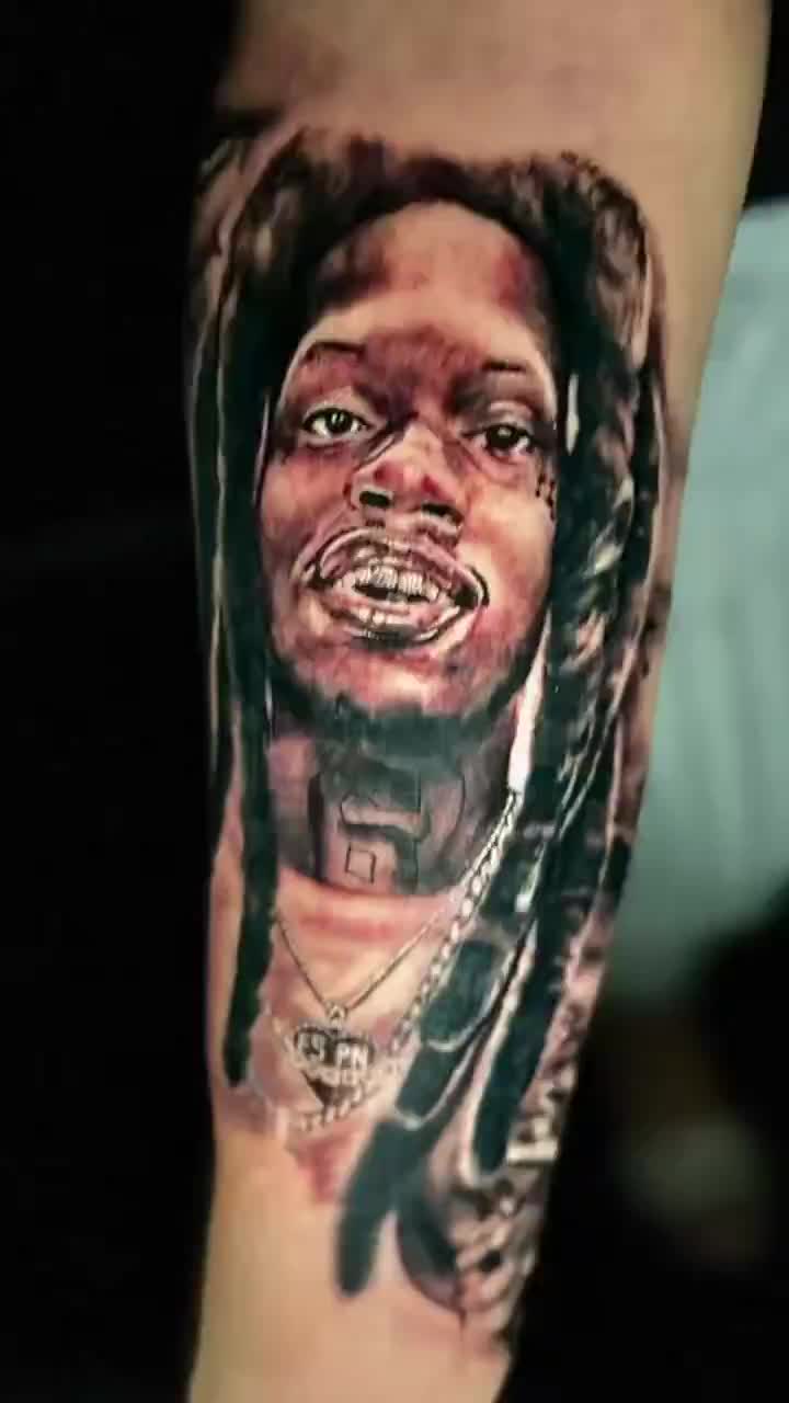 Julio Foolio's mother got his face tattooed on her arm. Rest in peace