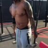 Nick cannon shows off his ski squat