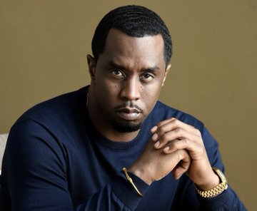 Diddy threatened to kill a former Vibe editor, Danyel Smith, by putting her 'in the trunk of a car' after she wouldn't allow him to change his cover photo.