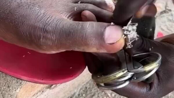 NIGERIA, Africa: You can get a "20 cent" pedicure on the side of the road in any shantytown or village