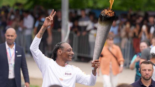 Snoop Dogg carries Olympic torch before 2024 Paris Olympics