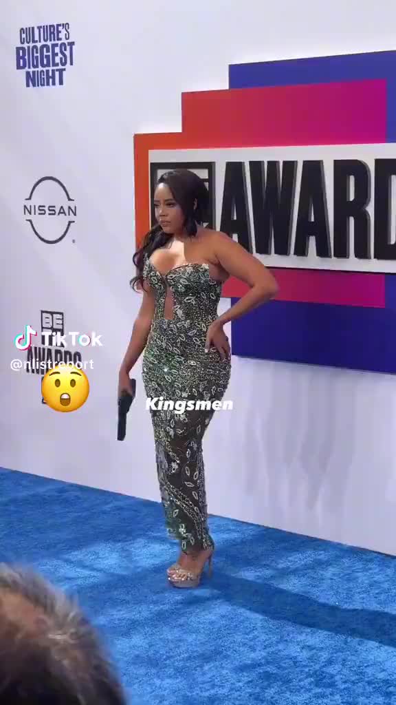 Angela Simmons with the gun purse at the BETAwards