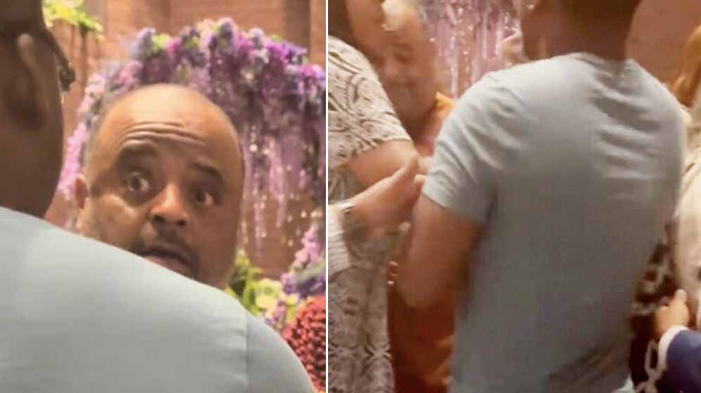 Roland Martin hides behind woman when confronted at DNC