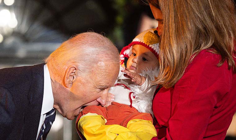 President Joe Biden Bites Several Babies at Halloween Party