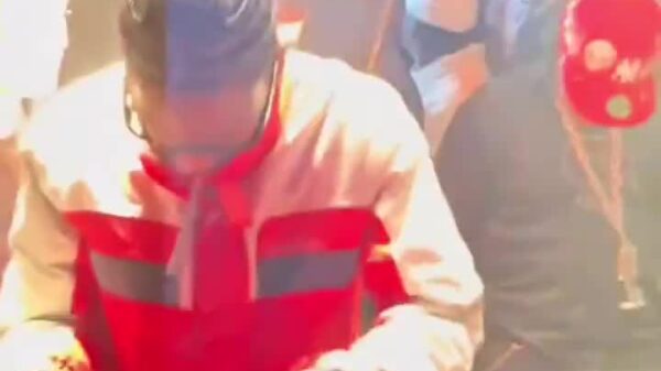 Travis Scott smashing a laptop in Paris