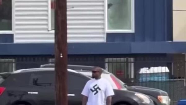 Kanye West trolls Jewish people wearing a swastika shirt in LA
