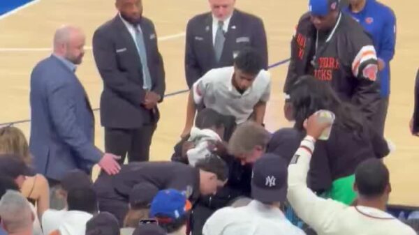 Tracy Morgan getting wheeled out from courtside at MSG