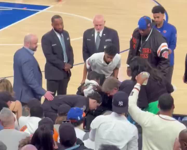 Tracy Morgan getting wheeled out from courtside at MSG